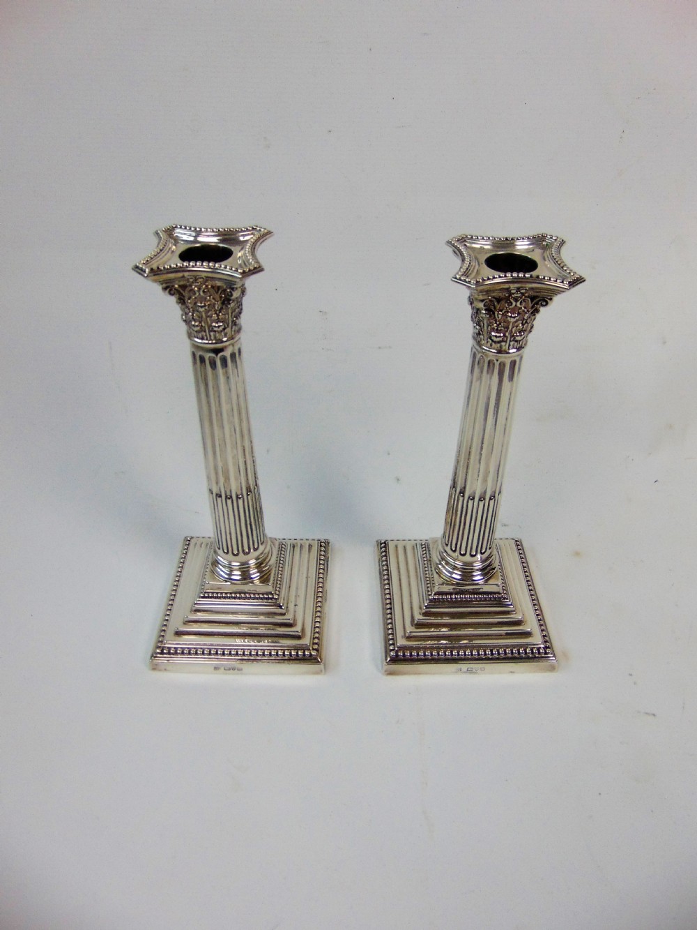  a fine pair pair of silver candlesticks by barker bros View II