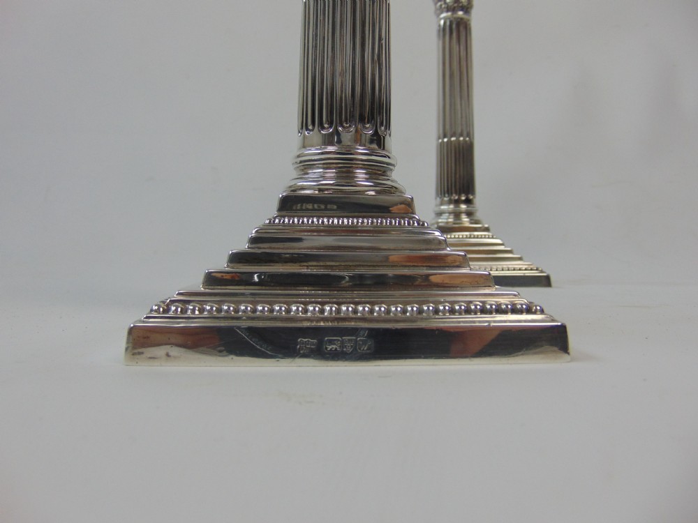  a fine pair pair of silver candlesticks by barker bros View V