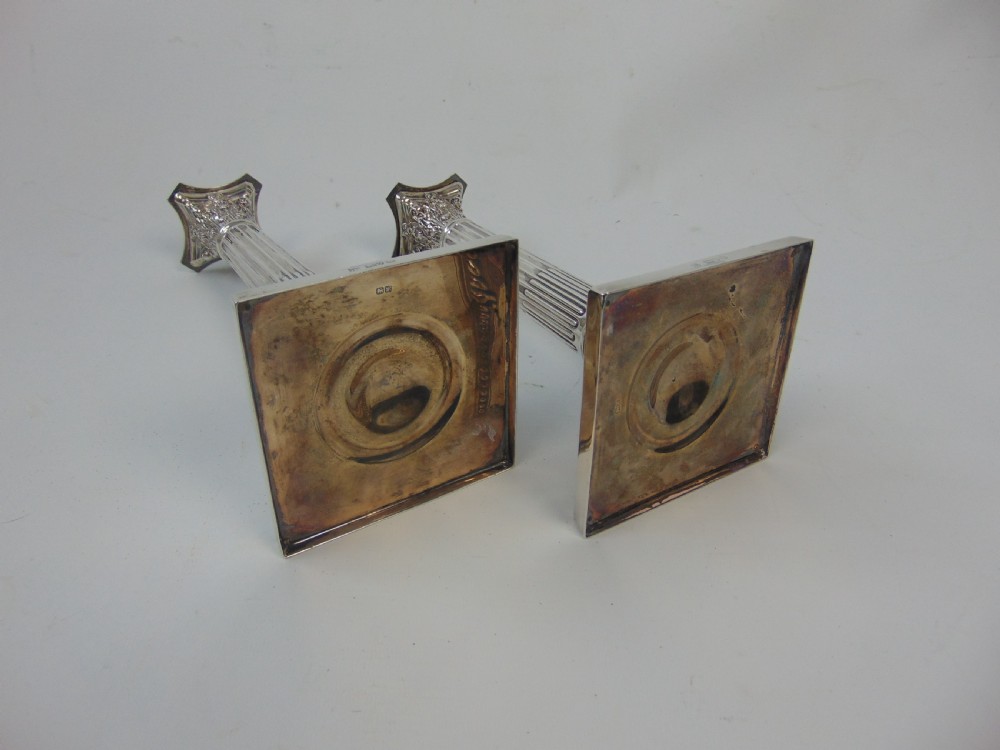  a fine pair pair of silver candlesticks by barker bros View VII