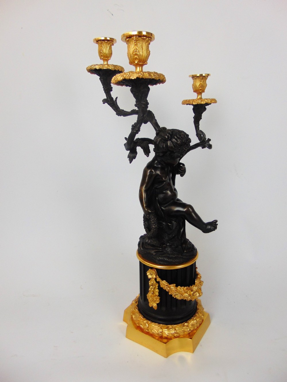 A large and good quality cherub bronze candlestick View III