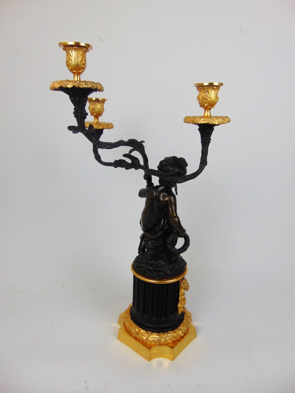 A large and good quality cherub bronze candlestick View IV
