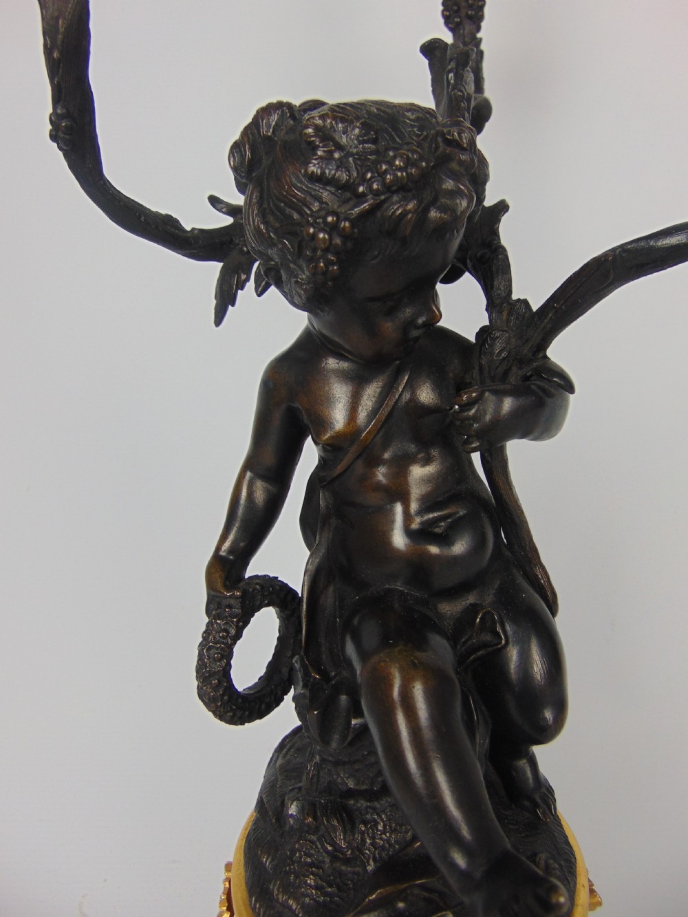 A large and good quality cherub bronze candlestick View V