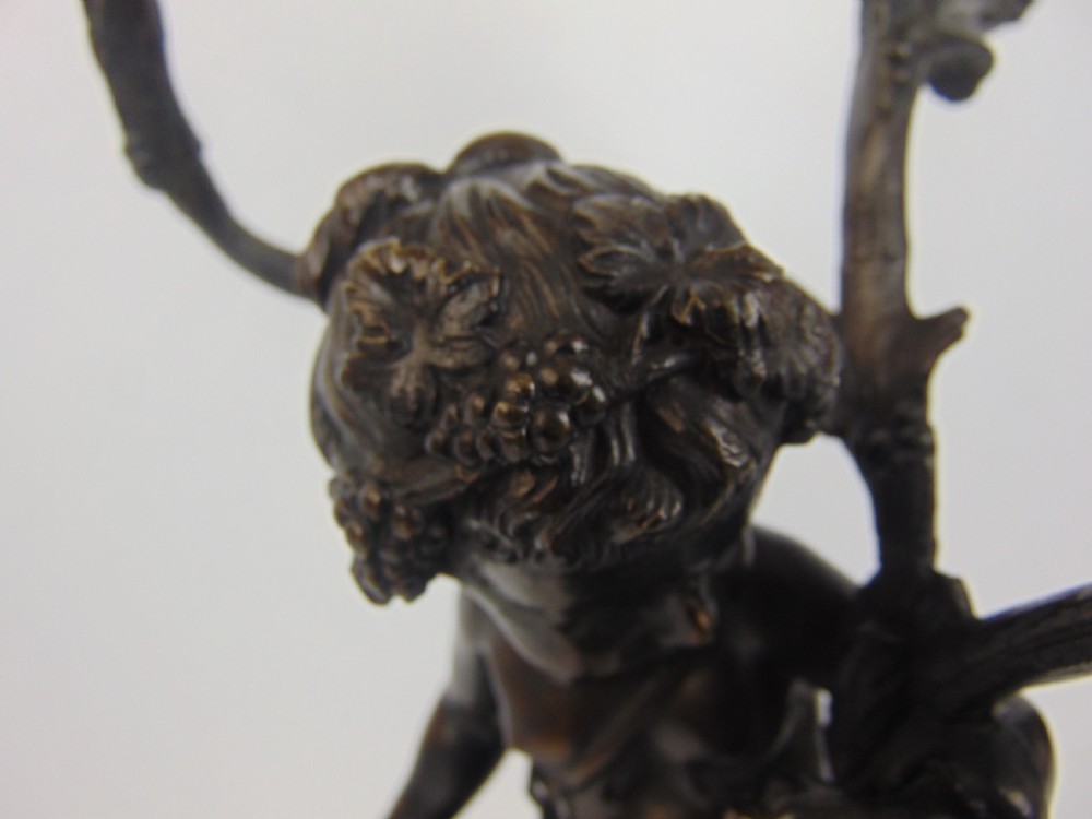A large and good quality cherub bronze candlestick View VI