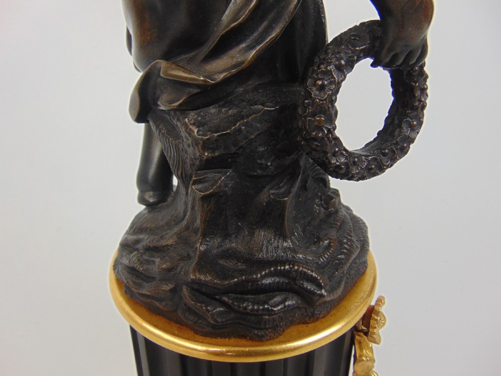 A large and good quality cherub bronze candlestick View VII