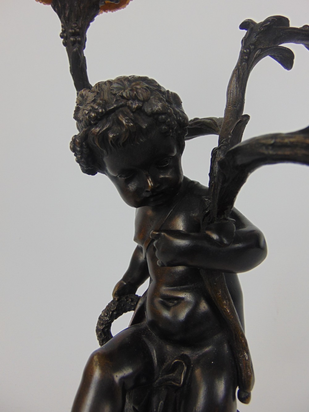 A large and good quality cherub bronze candlestick View VIII