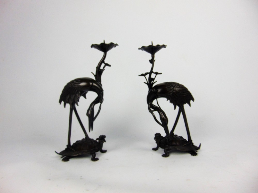 A pair of bronze candlesticks 