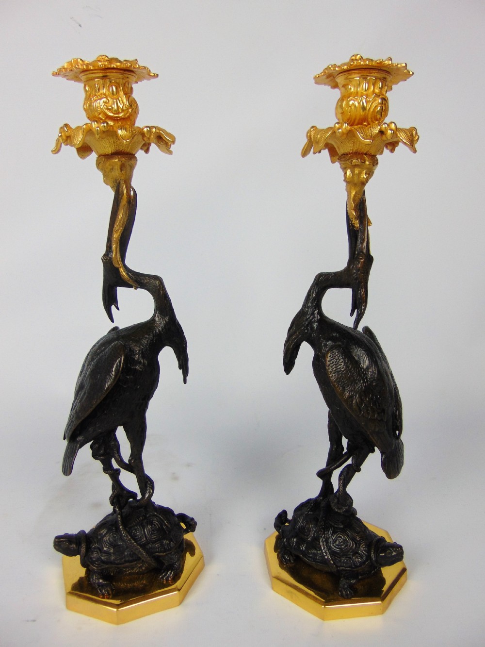 A quality Pair of bronze crane candlesticks