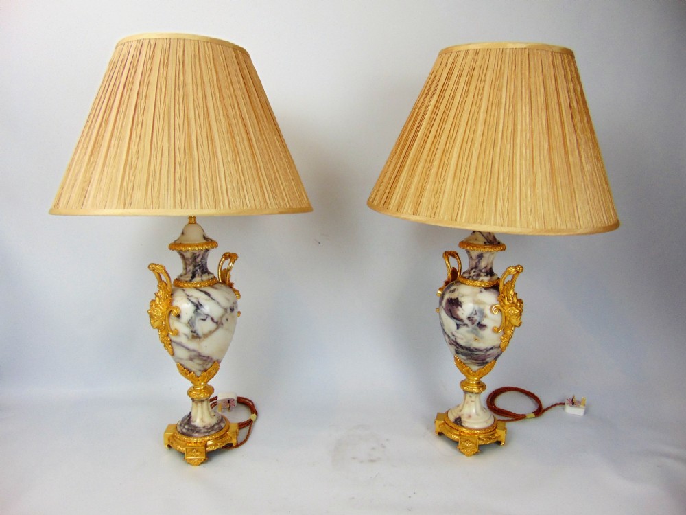 A large pair of marble table lamps 