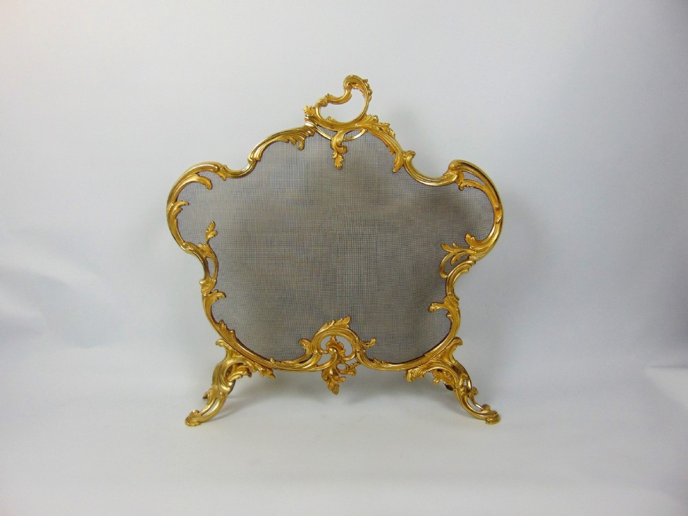 A fine gilt fire screen 