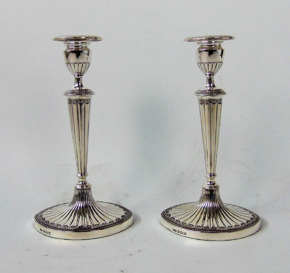 a FINE PAIR OF ELKINGTON SILVER CANDLESTICKS 