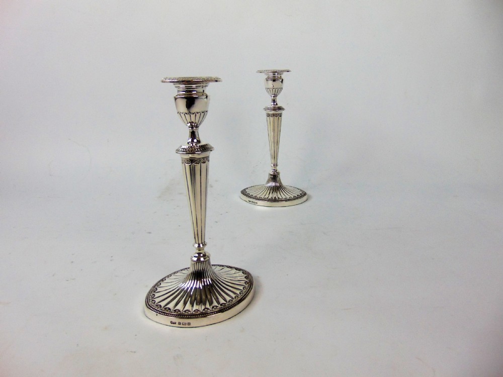 a FINE PAIR OF ELKINGTON SILVER CANDLESTICKS  View II