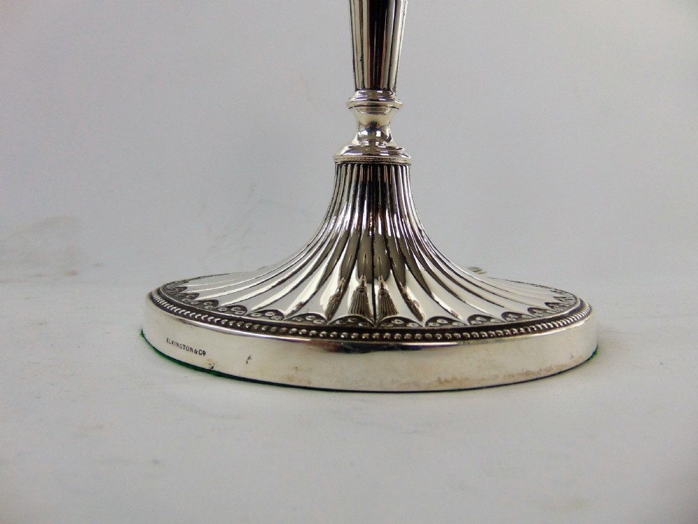 a FINE PAIR OF ELKINGTON SILVER CANDLESTICKS  View V