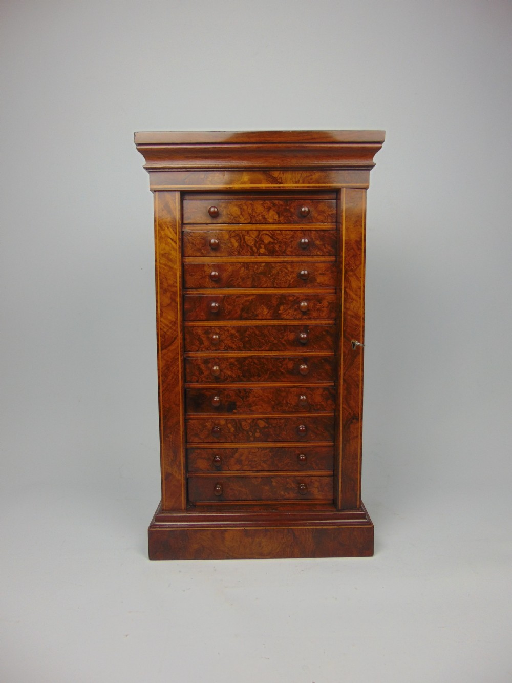 A rare miniature walnut wellington chest View III