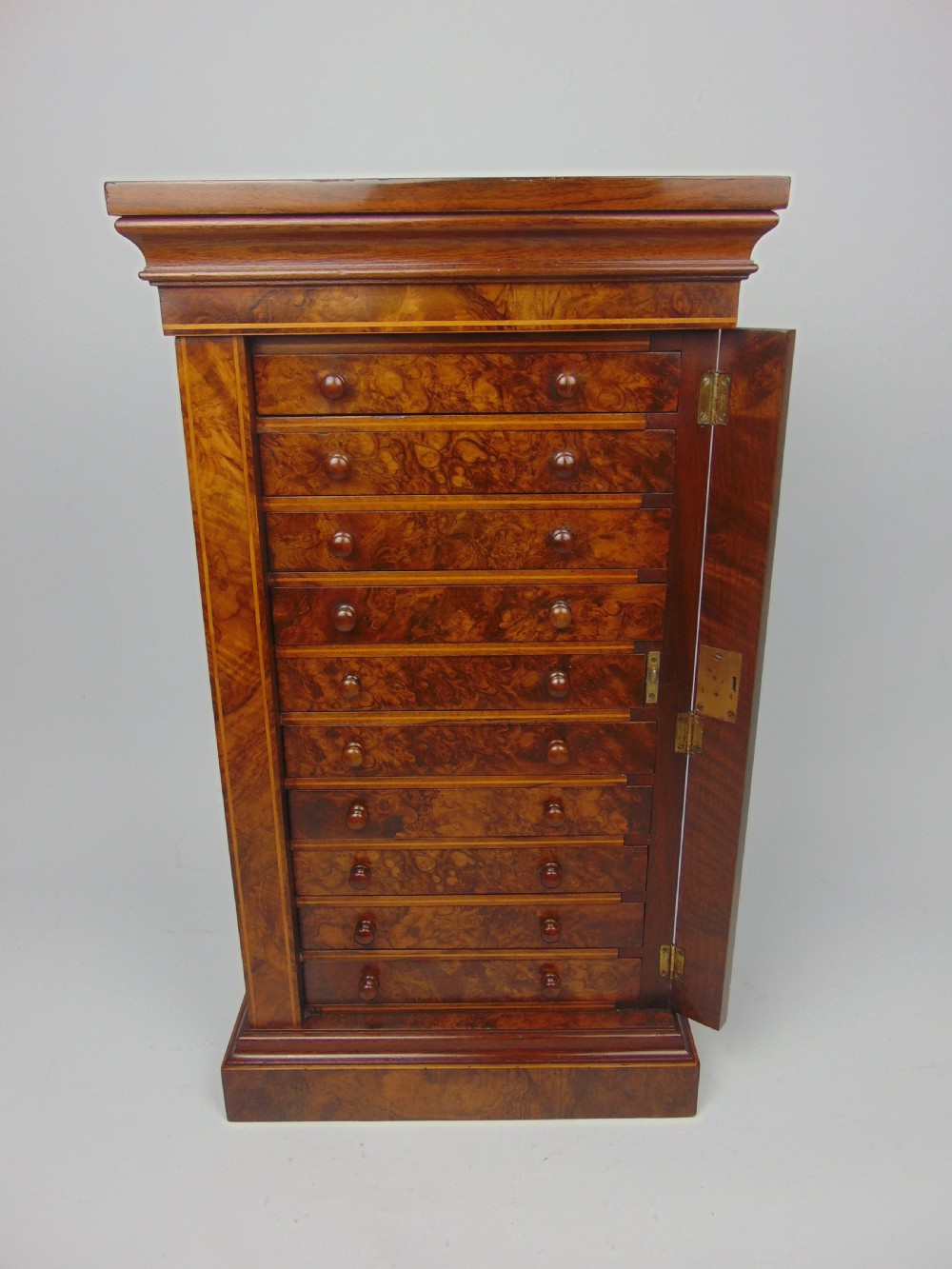 A rare miniature walnut wellington chest View IV