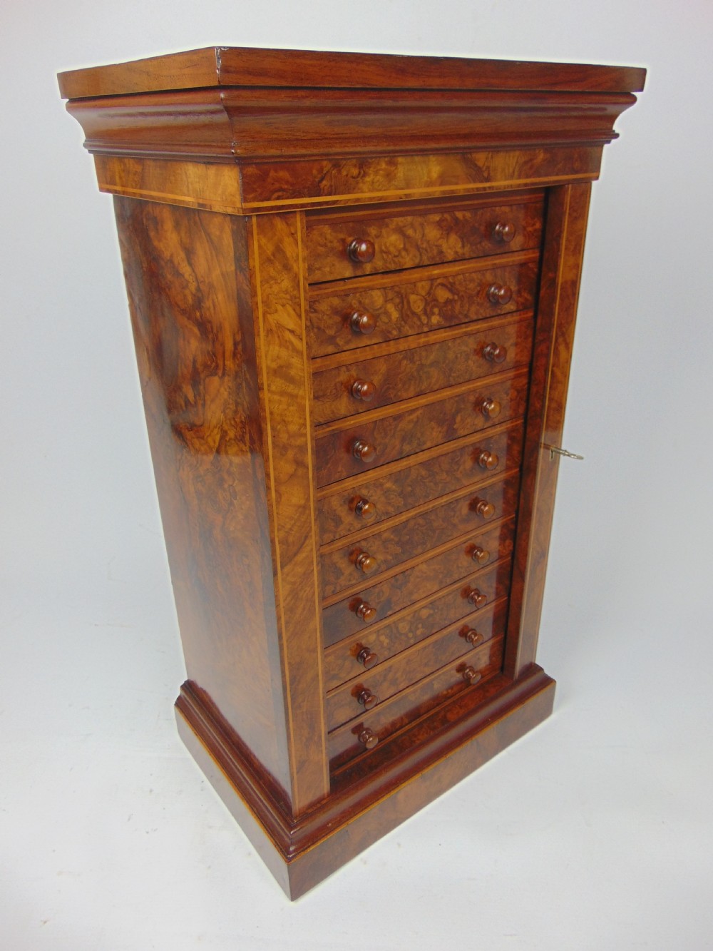 A rare miniature walnut wellington chest View V