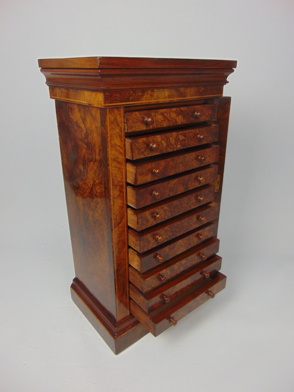 A rare miniature walnut wellington chest View VI