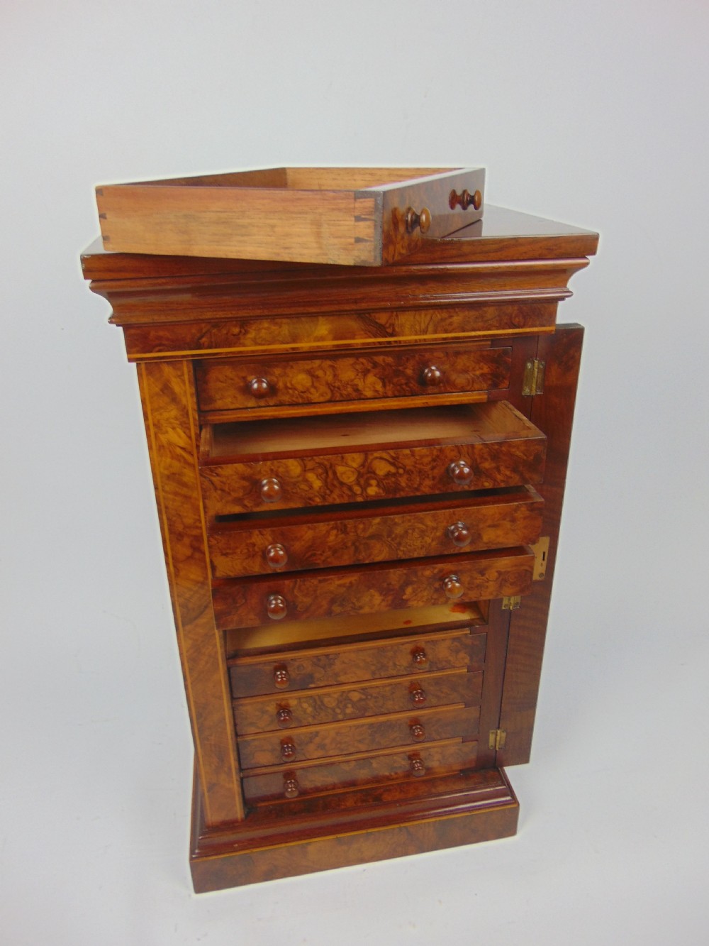 A rare miniature walnut wellington chest View VII