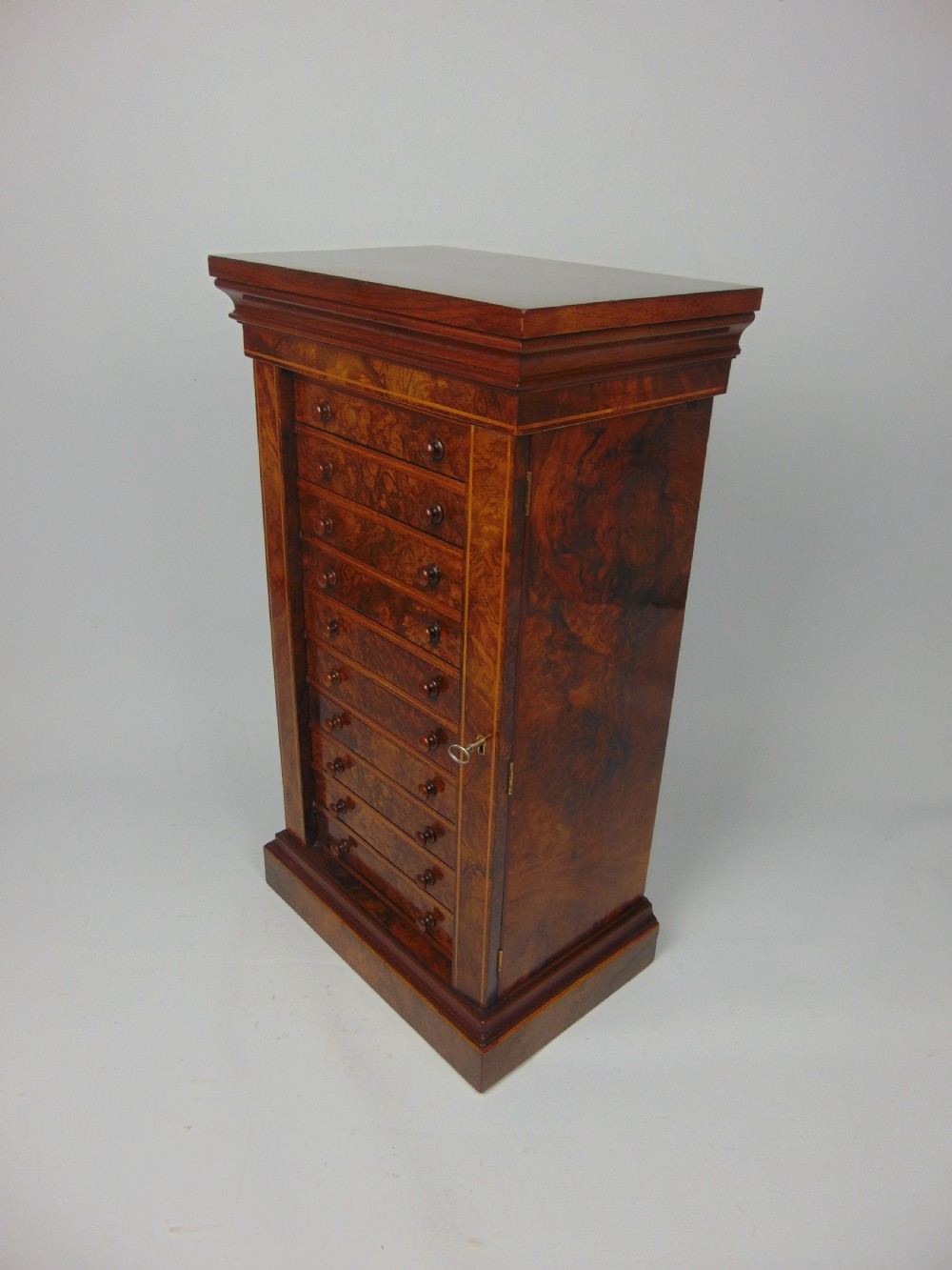 A rare miniature walnut wellington chest View VIII