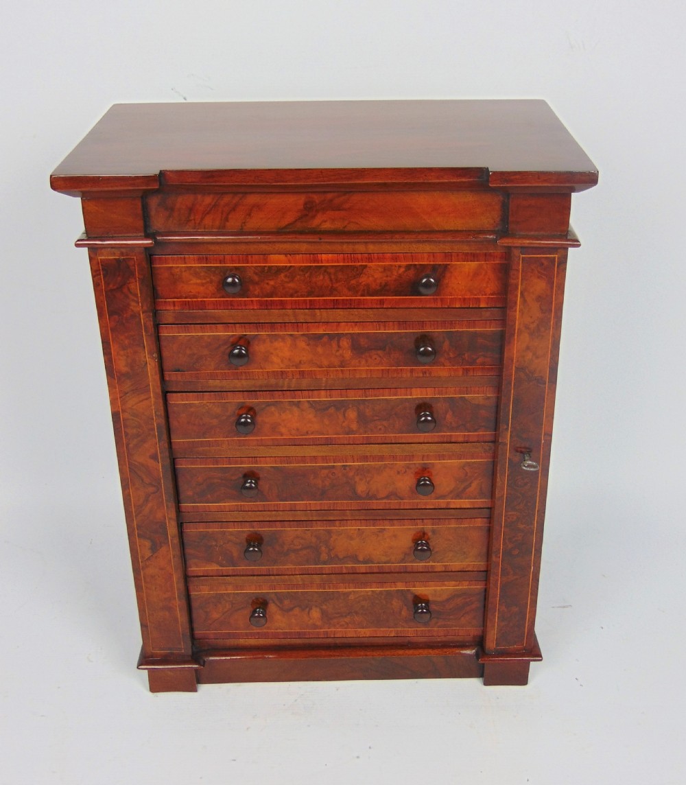 A rare walnut miniature collectors wellington chest 