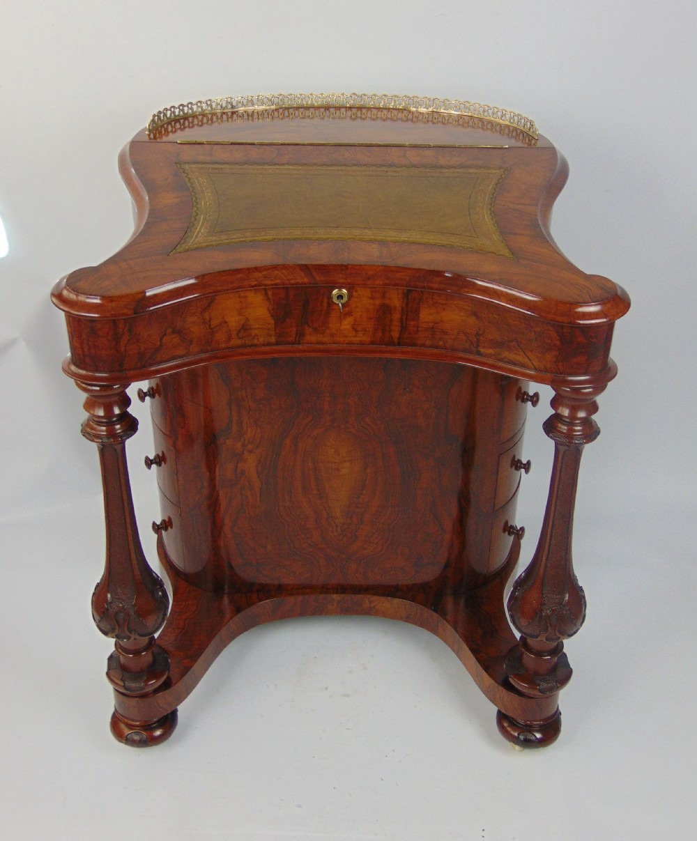 A exceptional Victorian walnut davenport desk