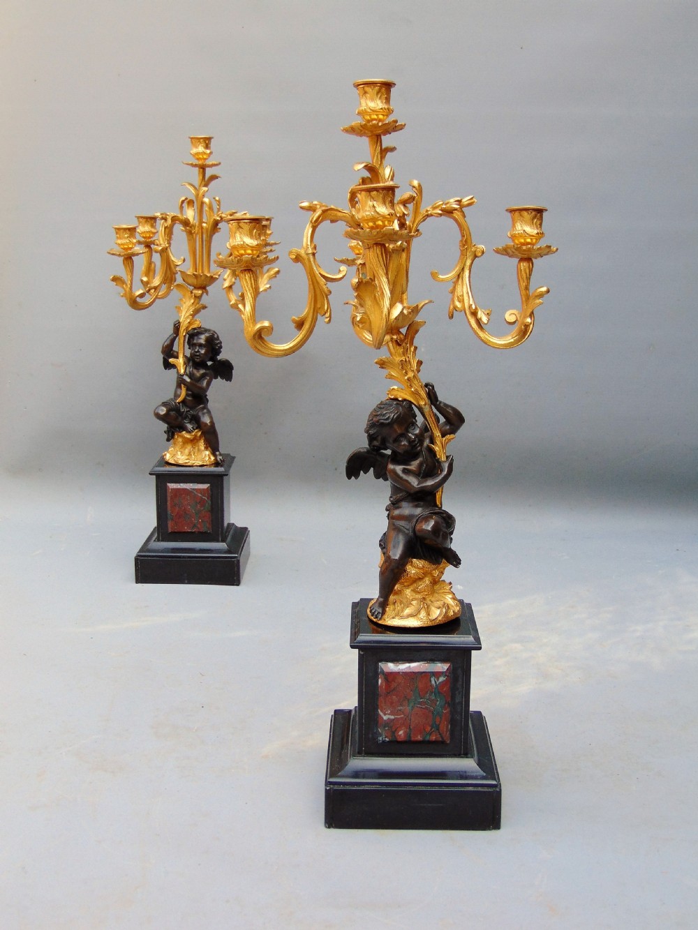 A large pair of bronze gilt cherub candelabra  View IV
