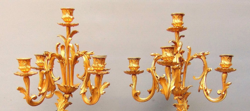 A large pair of bronze gilt cherub candelabra  View VI