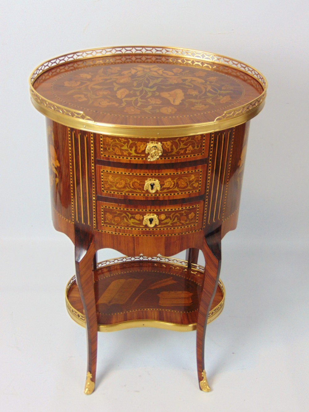 A superb marquetry oval side table  View II