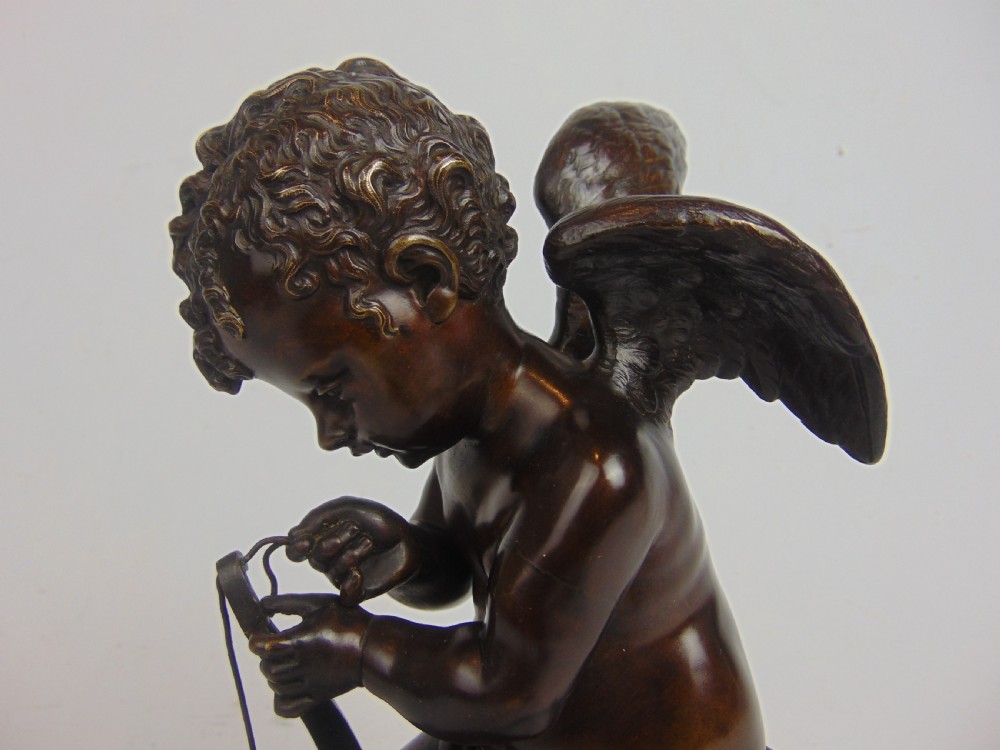 A Bronze Cupid stringing his bow  View III
