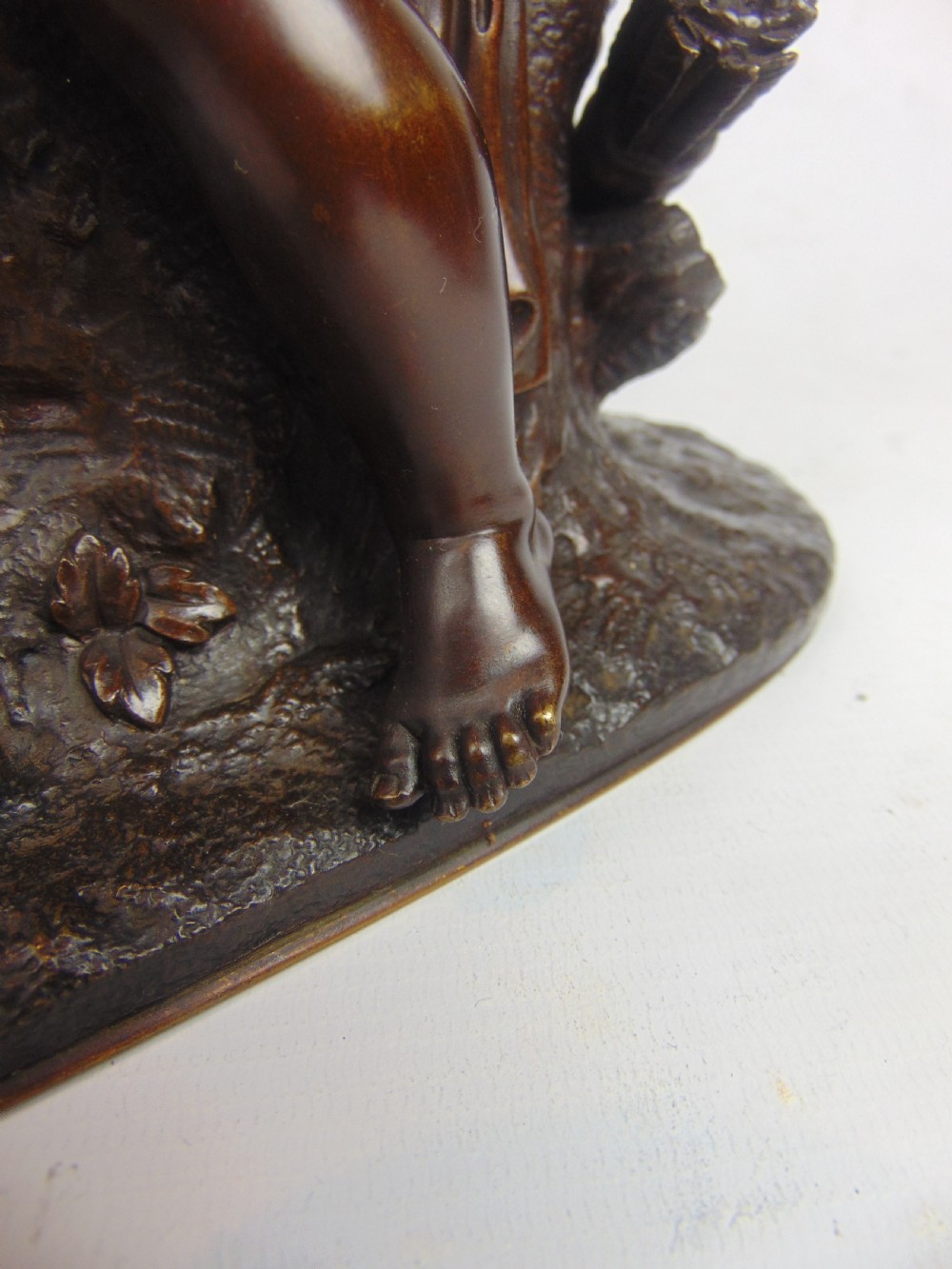 A Bronze Cupid stringing his bow  View IV