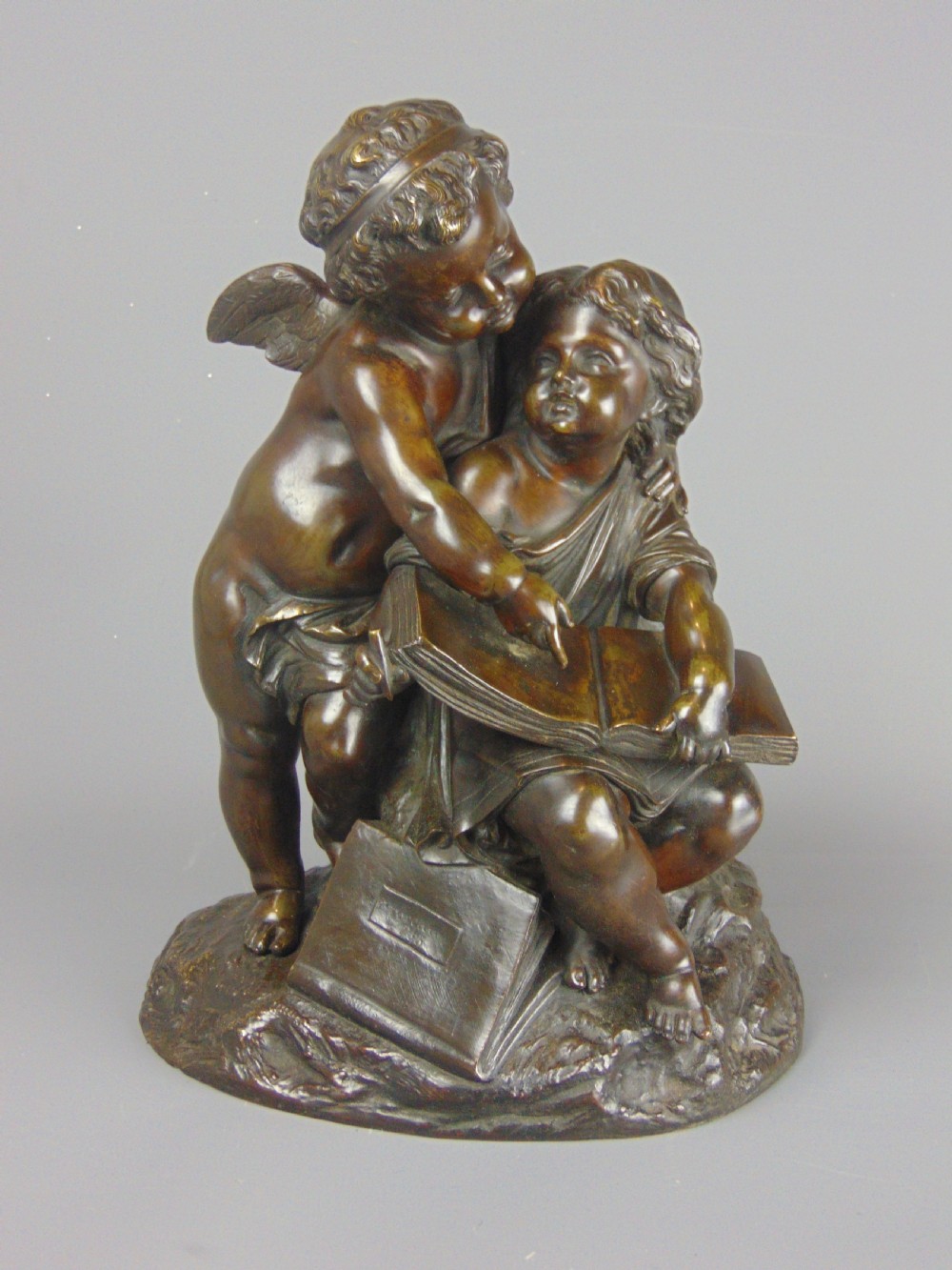 A fine Bronze of a Cherub and girl