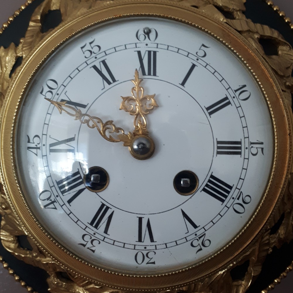 A Gilt and Bronze Cartel Ribbon Clock View II
