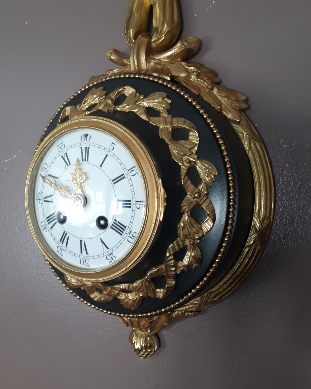 A Gilt and Bronze Cartel Ribbon Clock View IV