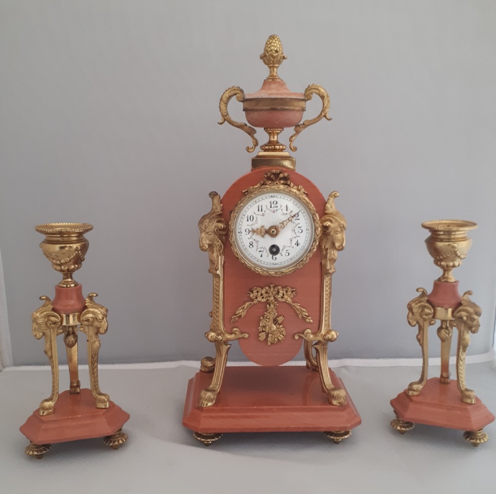 A fine marble and Gilt bronze clock set 