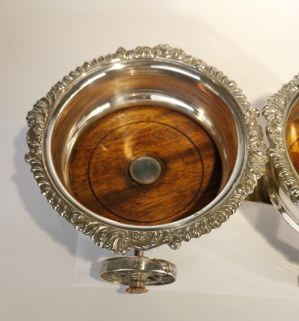 Victorian silver-plated double wine bottle trolley featuring two gadrooned coasters mounted on a wheeled frame with a long handle. View VIII
