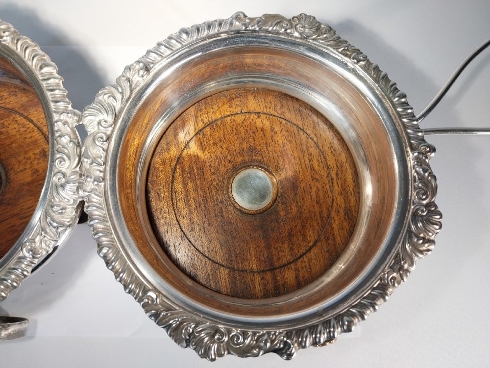 Victorian silver-plated double wine bottle trolley featuring two gadrooned coasters mounted on a wheeled frame with a long handle. View IX