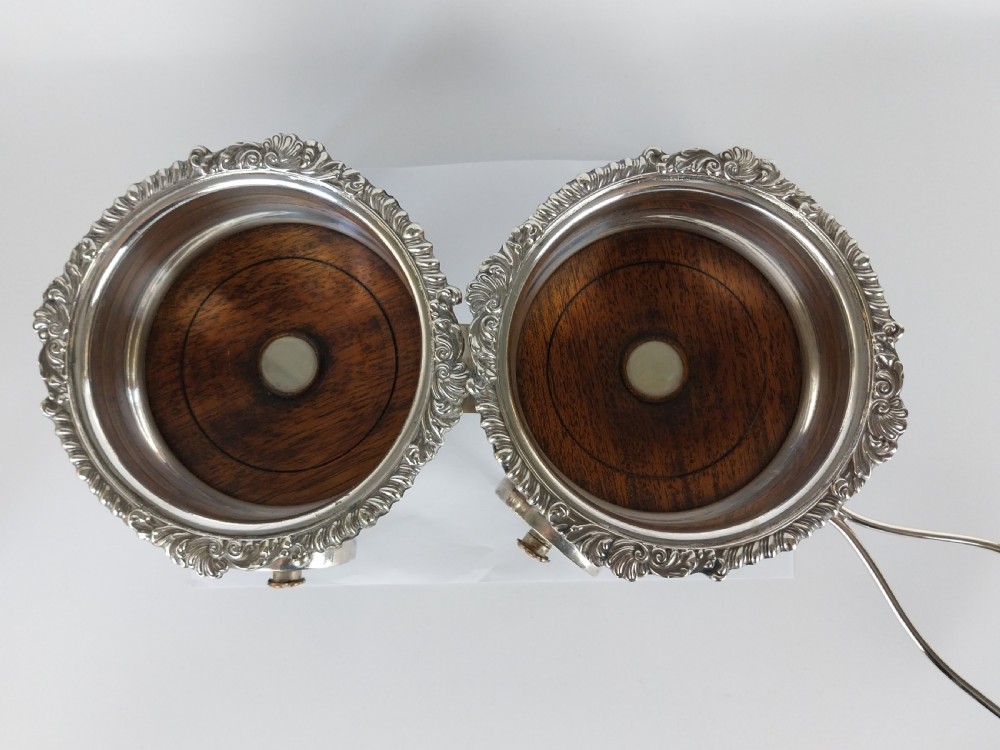 Victorian silver-plated double wine bottle trolley featuring two gadrooned coasters mounted on a wheeled frame with a long handle. View XXI