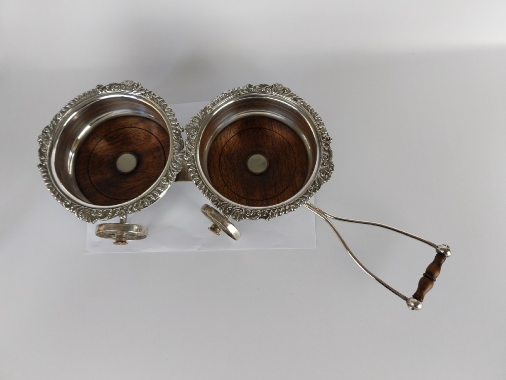 Victorian silver-plated double wine bottle trolley featuring two gadrooned coasters mounted on a wheeled frame with a long handle. View XXIII