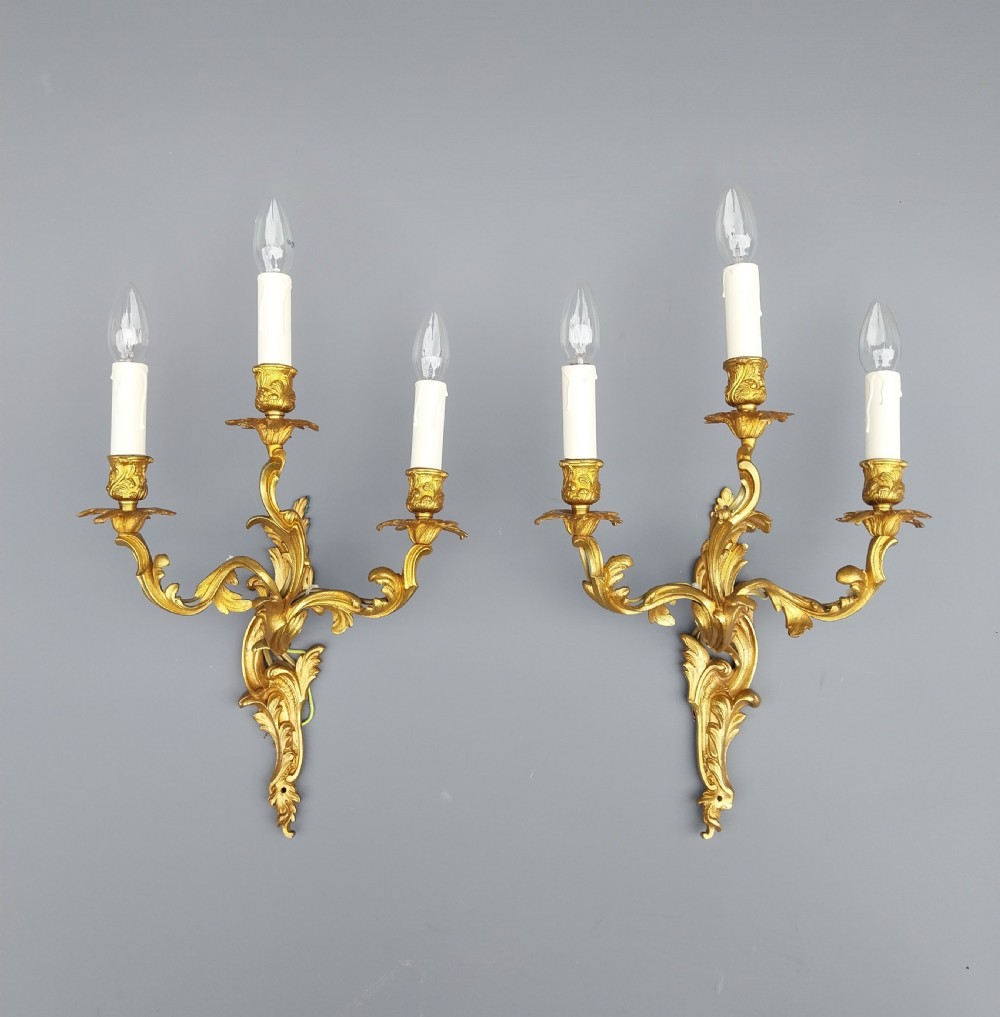 A pair of Gilt Bronze wall lights 