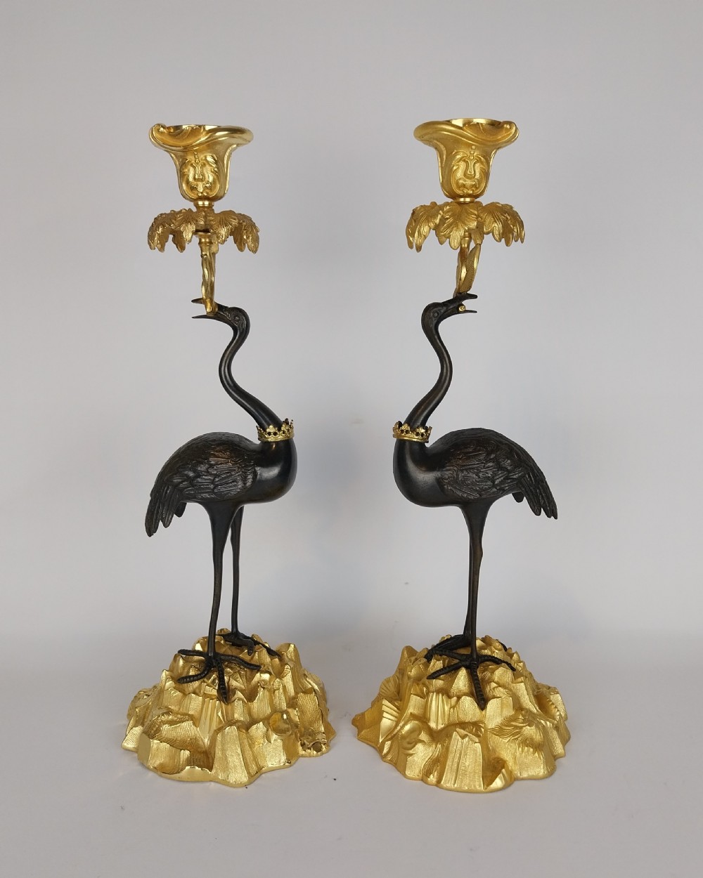 A Pair of Gilt and Bronze Stork Candlesticks 