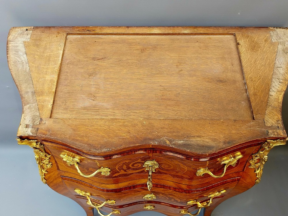 A Petite Bombe shaped French Chest of drawers  View XVII