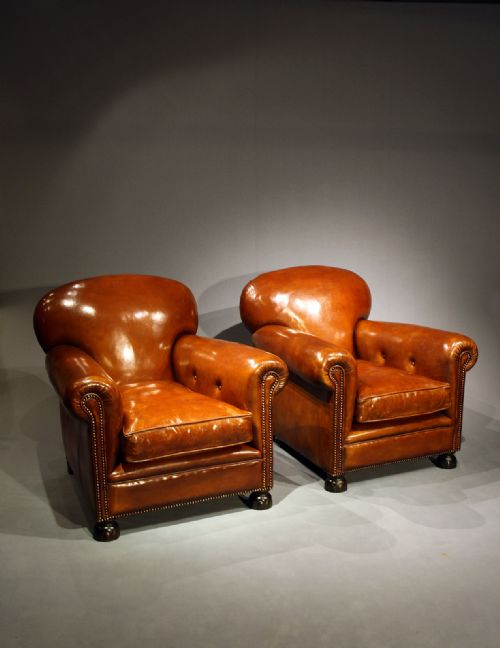 A Pair of Antique Leather Clubs Chairs