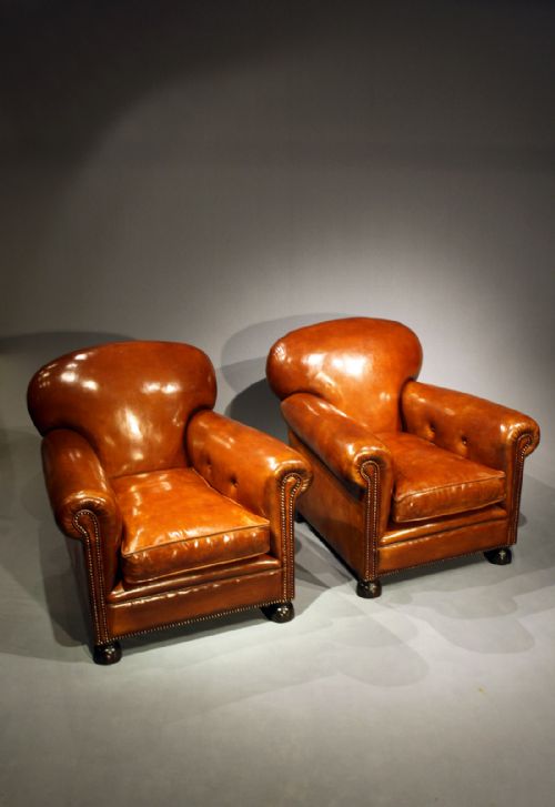 fig 2. A Pair Of Antique Leather Clubs Chairs