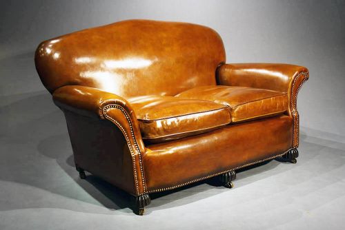 A 1920'S Leather Upholstered Shaped Couch