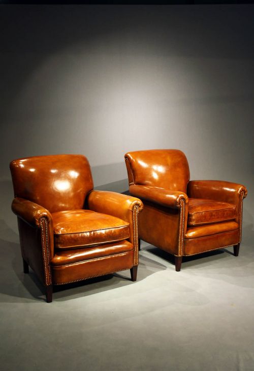 fig 1. A Pair of Leather Armchairs on Tapering Feet