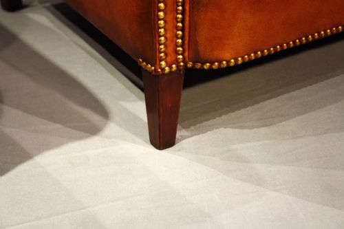 fig 2. A Pair of Leather Armchairs on Tapering Feet