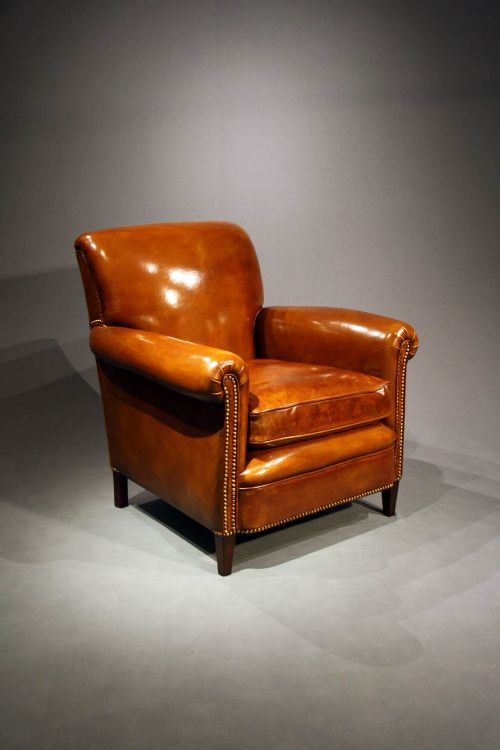 fig 4. A Pair of Leather Armchairs on Tapering Feet