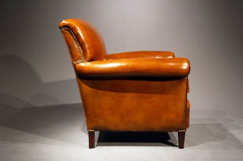 fig 7. A Pair of Leather Armchairs on Tapering Feet