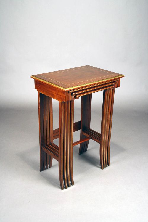 fig 6. A French Nest of Four Brass Inlaid Tables