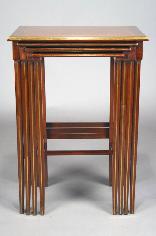 fig 9. A French Nest of Four Brass Inlaid Tables
