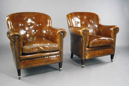 fig 1. A pair of Antique Leather Shaped Armchairs